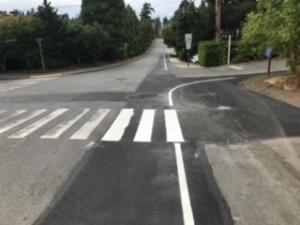 Photo 2: Painted fog lines and crosswalk bars on SE 24th St near 81st Ave SE