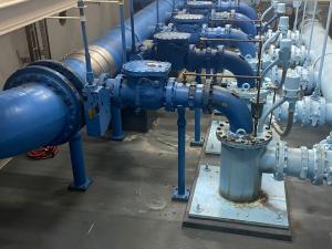 The primary scope of work involves replacing the five vertical turbine style pumps shown. 