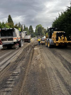 Removing existing asphalt and grading the subgrade on 90th Avenue SE.