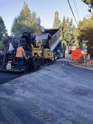 Paving bottom lift of asphalt on 90th Avenue SE and SE 37th Street.