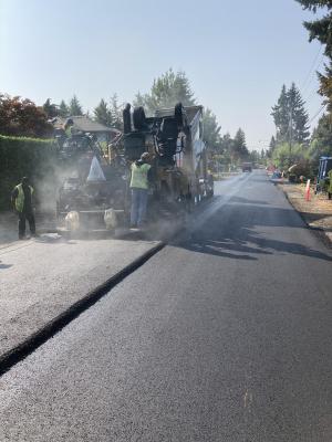 Paving the final layer of asphalt on 88th Avenue SE