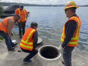 The wet-well access cover is removed. Evaluation of this confined space will occur during a future v…