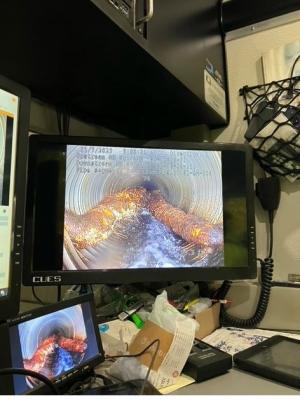 Image from work van during CCTV inspection showing large roots inside of a 36-inch pipe.