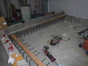 Finished containment wall and new rebar for the equipment pads in the sodium hypochlorite tank room.