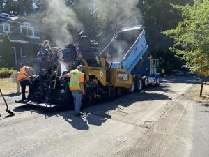 Repairing a damaged section of pavement on SE 36th Street before placing the final lift of asphalt.