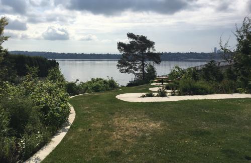 A street end parking featuring a concrete path that snakes down to the water
