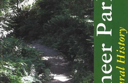 Book cover showing a forested trail and the title Pioneer Park: A Natural History