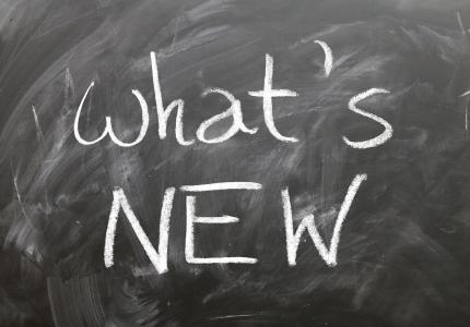 Chalkboard with writing "what's new"