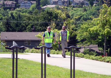 Emergency Management Volunteers in action wearing a uniform of neon yellow vests