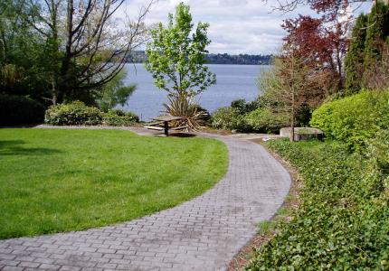 A community park featuring lake views, public art, and a picnic area
