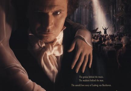 An 18th-century man stares intensely at the viewer in this movie poster for the Immortal Beloved, a film about Beethoven