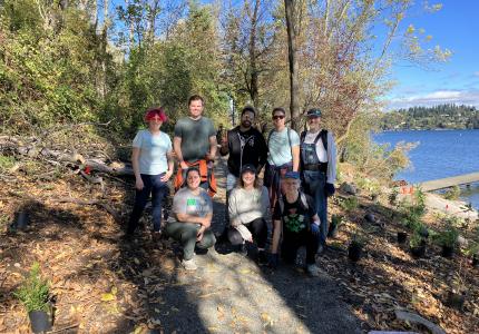 Volunteers posing in the south shoreline trail. 