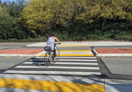 Biker using the I-90 Trail Crossings at West Mercer Way