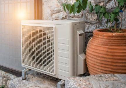 Heat pump next to planter