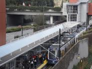 One of the first trains stops at Mercer Island Station on the morning of the Crosslink Connection's opening.