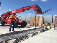 Workers replace an expansion joint on a previous WSDOT project.