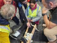 Group of CERT participants apply disaster medical skills.