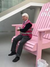 Rich Conrad tries out the big Evian Adirondack in the lobby. Rich Conrad tries out the big Evian Adirondack in the lobby.