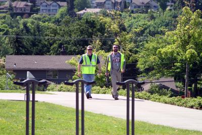 Emergency Management Volunteers in action wearing a uniform of neon yellow vests