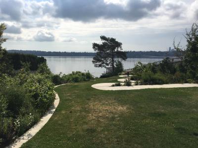 A street end parking featuring a concrete path that snakes down to the water