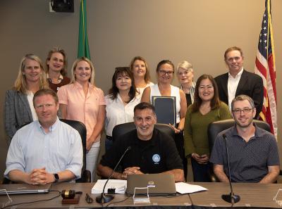 A picture of MIYFS Foundation board members and staff with members of the Mercer Island City Council.
