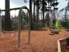 A neighborhood playground features swings and a 20' climbing structure with two bright green slides
