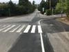 Painted fog lines and crosswalk bars on SE 24th St near 81st Ave SE