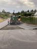 Watson’s asphalt paver placing the first lift of hot mix asphalt on SE 66th Street.