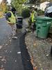 Installing asphalt berm on SE 36th Street.