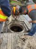 consultant looking down into pump station