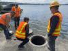 The wet-well access cover is removed. Evaluation of this confined space will occur during a future visit. 