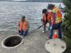 RH2 Engineering design staff uses a pole-mounted inspection camera to assess the condition of the existing wet well structure. 