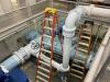 All new piping is first primed with a base coat, then finished with a color-coded top coat for system identification.