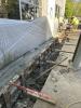 Concrete grade beam pour in progress.