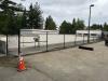 Fence with fabric mesh installed.