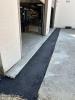 1st lift of asphalt paving at shop doors.