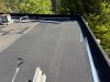 SBS roofing membrane installed, preparing for parapet wall coping.
